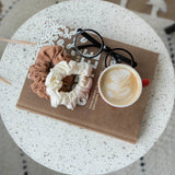 KOOSHOO organic cotton scrunchies flat lay with good book, reading glasses and morning coffee #color_cappuccino