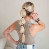 Lifestyle Image of KOOSHOO plastic-free round hair ties mondo 5 pack dark hues #color_dark-hues