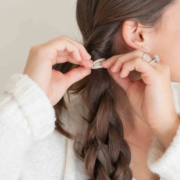 Lifestyle Image of KOOSHOO plastic-free round hair ties mondo 8 pack pastel blooms	#color_pastel-blooms